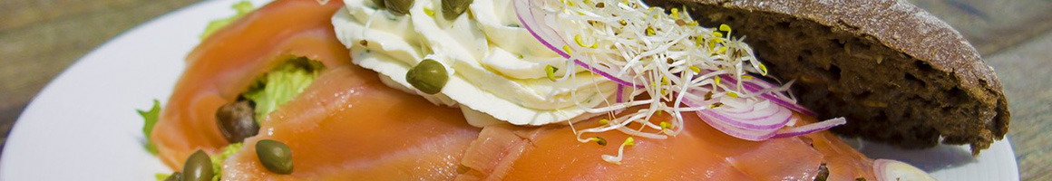 Eating Sandwich Bagels at F & M Cafe restaurant in Brooklyn, NY.